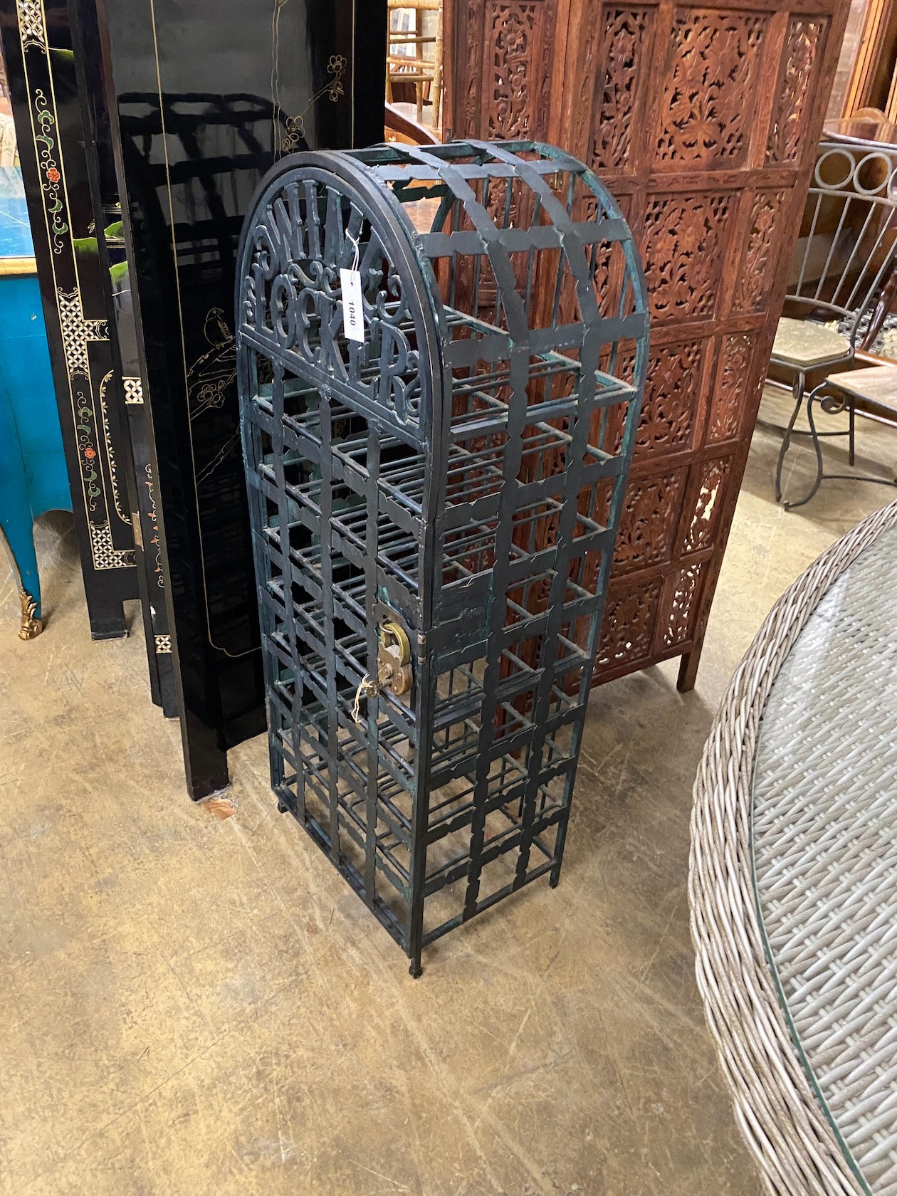 A painted wrought iron 32 bottle wine locker with padlock, width 43cm, height 112cm